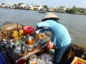 Famous Vietnamese iced coffee being prepared on a boat in the floating market, Mekong Delta