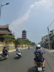 Wheeee motorcycling towards a pagoda!